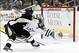 Mar 18, 2014; Pittsburgh, PA, USA; Pittsburgh Penguins center Sidney Crosby (left) scores on a back-handed shot past Dallas Stars goalie Kari Lehtonen (32) during the first period at the CONSOL Energy Center. Mandatory Credit: Charles LeClaire-USA TODAY S