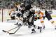 Mar 16, 2014; Pittsburgh, PA, USA; Pittsburgh Penguins right wing Lee Stempniak (22) carries the puck against the Philadelphia Flyers during the second period at the CONSOL Energy Center. The Flyers won 4-3. Mandatory Credit: Charles LeClaire-USA TODAY S