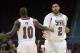 Mar 15, 2013; Las Vegas, NV, USA; New Mexico State Aggies center Sim Bhullar (2) and forward Sy Bandja (10) celebrate against the Texas State Bobcats during the semifinals of the WAC tournament at Orleans Arena. New Mexico State defeated Texas State 74-6