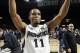 Mar 4, 2014; Providence, RI, USA; Providence Friars guard Bryce Cotton (11) celebrates after making two free throws in the final second to defeat the Marquette Golden Eagles 81-80 in double overtime at the Dunkin' Donuts Center. Mandatory Credit: Stew Mil