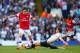 LONDON, ENGLAND - MARCH 16: Jan Vertonghen of Tottenham Hotspur tackles Tomas Rosicky of Arsenal during the Barclays Premier League match between Tottenham Hotspur and Arsenal at White Hart Lane on March 16, 2014 in London, England. (Photo by Paul Gilha