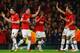 MANCHESTER, ENGLAND - MARCH 19: Robin van Persie of Manchester United celebrates scoring the second goal with his team-mates during the UEFA Champions League Round of 16 second round match between Manchester United and Olympiacos FC at Old Trafford on Ma