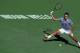 INDIAN WELLS, CA - MARCH 16: Roger Federer of Switzerland lunges to return a forehand to Novac Djokovic of Serbia during the final of the BNP Paribas Open at Indian Wells Tennis Garden on March 16, 2014 in Indian Wells, California. (Photo by Jeff Gross/