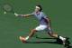 INDIAN WELLS, CA - MARCH 16: Roger Federer of Switzerland lunges to return a forehand to Novac Djokovic of Serbia during the final of the BNP Paribas Open at Indian Wells Tennis Garden on March 16, 2014 in Indian Wells, California. (Photo by Jeff Gross/