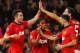 MANCHESTER, ENGLAND - MARCH 19: Robin van Persie of Manchester United celebrates scoring the second goal with his team-mates during the UEFA Champions League Round of 16 second round match between Manchester United and Olympiacos FC at Old Trafford on Ma