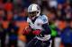 DENVER, CO - DECEMBER 8: Running back Chris Johnson #28 of the Tennessee Titans runs with the ball against the Denver Broncos at Sports Authority Field Field at Mile High on December 8, 2013 in Denver, Colorado. The Broncos defeated the Titans 51-28. (P