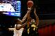 DAYTON, OH - MARCH 19: Roy Devyn Marble #4 of the Iowa Hawkeyes takes a shot over Josh Richardson #1 of the Tennessee Volunteers during the first round of the 2014 NCAA Men's Basketball Tournament at UD Arena on March 19, 2014 in Dayton, Ohio. (Photo by