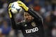 KANSAS CITY, KS - DECEMBER 7: Nick Rimando #18 of Real Salt Lake jumps behind Nat Borchers #6 as he catches the ball on a corner kick in the in the MLS Cup Final against the Sporting Kansas City at Sporting Park on December 7, 2013 in Kansas City, Kansas