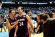 CHAPEL HILL, NC - NOVEMBER 17: Spencer Turner #11 and J.J. Mann #24 of the Belmont Bruins leave the court after a last-second win over the North Carolina Tar Heels at the Dean Smith Center on November 17, 2013 in Chapel Hill, North Carolina. Mann hit the