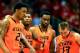 LAWRENCE, KS - JANUARY 18: Le'Bryan Nash #2, Marcus Smart #33, Brian Williams #4, and Phil Forte, III #13 of the Oklahoma State Cowboys walk back upcourt after a foul during the game against the Kansas Jayhawks at Allen Fieldhouse on January 18, 2014 in