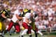 1 Jan 1998: Quarterback Ryan Leaf #16 of Washington State is sacked by James Hall #56 of Michigan during the Cougars 21-16 loss to Michigan in the 1998 Rose Bowl at the Rose Bowl in Pasadena, California. Mandatory Credit: Jed Jacobsohn /Allsport