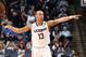MEMPHIS, TN - MARCH 13: Shabazz Napier #13 of the Connecticut Huskies points against the Memphis Tigers during the quarterfinal round of the American Athletic Conference Tournament at FedExForum on March 13, 2014 in Memphis, Tennessee. (Photo by Joe Murph