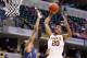 INDIANAPOLIS, IN - MARCH 13: Austin Hollins #20 of the Minnesota Golden Gophers shoots the ball in the game against the Penn State Nittany Lions during the first round of the Big Ten Basketball Tournament at Bankers Life Fieldhouse on March 13, 2014 in