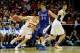 Mar 20, 2014; Milwaukee, WI, USA; Wisconsin Badgers guard Bronson Koenig (24) drives past American University Eagles center Tony Wroblicky (34) during the second round of the 2014 NCAA Tournament at BMO Harris Bradley Center. Mandatory Credit: Benny Sieu-