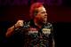 LONDON, ENGLAND - JANUARY 01: Peter Wright of Scotland celebrates winning the fifth set during the final of the Ladbrokes.com World Darts Championships against Michael van Gerwen of The Netherlands at Alexandra Palace on January 1, 2014 in London, Englan