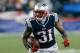 FOXBORO, MA - SEPTEMBER 12: Aqib Talib #31 of the New England Patriots runs the ball after he intercepted a pass intended for a New York Jets receiver in the 4th quarter at Gillette Stadium on September 12, 2013 in Foxboro, Massachusetts. (Photo by Jim Ro