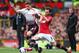 MANCHESTER, ENGLAND - MARCH 16: Jon Flanagan of Liverpool competes with Juan Mata of Manchester United during the Barclays Premier League match between Manchester United and Liverpool at Old Trafford on March 16, 2014 in Manchester, England. (Photo by A