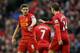 LIVERPOOL, ENGLAND - FEBRUARY 23: Jordan Henderson of Liverpool celebrates scoring his team's fourth goal with his team-mate Steven Gerrard during the Barclays Premier League match between Liverpool and Swansea City at Anfield on February 23, 2014 in Liv
