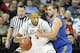 Mar 20, 2014; Spokane, WA, USA; Michigan State Spartans forward Adreian Payne (5) dribbles against Delaware Fightin Blue Hens forward Carl Baptiste (33) in the first half of a men's college basketball game during the second round of the 2014 NCAA Tourname