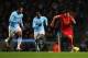 MANCHESTER, ENGLAND - DECEMBER 26: Luis Suarez of Liverpool takes on Joleon Lescott of Manchester City during the Barclays Premier League match between Manchester City and Liverpool at Etihad Stadium on December 26, 2013 in Manchester, England. (Photo b