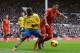 LIVERPOOL, ENGLAND - FEBRUARY 08: Luis Suarez of Liverpool is challenged by Bacary Sagna of Arsenal during the Barclays Premier League match between Liverpool and Arsenal at Anfield on February 8, 2014 in Liverpool, England. (Photo by Michael Regan/Gett