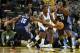 Feb 4, 2014; Oakland, CA, USA; Charlotte Bobcats point guard Kemba Walker (15) fouls Golden State Warriors small forward Harrison Barnes (40) during the second quarter at Oracle Arena. Mandatory Credit: Kelley L Cox-USA TODAY Sports