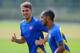 ST ALBANS, ENGLAND - AUGUST 26: Aaron Ramsey and Theo Walcott of Arsenal warm up during a training session ahead of their UEFA Champions League Play Off second leg match against Fenerbache at London Colney on August 26, 2013 in St Albans, England. (Photo