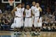 Mar 20, 2014; Spokane, WA, USA; Michigan State Spartans guard Gary Harris (14), guard/forward Branden Dawson (22), guard Keith Appling (11), forward Adreian Payne (5), and guard Denzel Valentine (45) look on in the second half of a men's college basketbal
