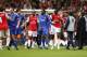 CARDIFF, UNITED KINGDOM - FEBRUARY 25: Arsenal Manager Arsene Wenger and Chelsea Manager Jose Mourinho come on to the pitch to try and calm the players down after a brawl during the Carling Cup Final match between Chelsea and Arsenal at the Millennium St