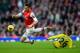 LONDON, ENGLAND - FEBRUARY 22: Olivier Giroud of Arsenal (L) is challenged by Liam Bridcutt of Sunderland during the Barclays Premier League match between Arsenal and Sunderland at Emirates Stadium on February 22, 2014 in London, England. (Photo by Mich