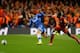 LONDON, ENGLAND - MARCH 18: Eden Hazard of Chelsea evades Emmanuel Eboue of Galatasaray during the UEFA Champions League Round of 16 second leg match between Chelsea and Galatasaray AS at Stamford Bridge on March 18, 2014 in London, England. (Photo by M