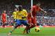 LIVERPOOL, ENGLAND - FEBRUARY 08: Luis Suarez of Liverpool is challenged by Bacary Sagna of Arsenal during the Barclays Premier League match between Liverpool and Arsenal at Anfield on February 8, 2014 in Liverpool, England. (Photo by Michael Regan/Gett