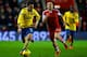 SOUTHAMPTON, ENGLAND - JANUARY 28: Luke Shaw of Southampton closes down Mesut Oezil of Arsenal during the Barclays Premier League match between Southampton and Arsenal at St Mary's Stadium on January 28, 2014 in Southampton, England. (Photo by Mike Hewi