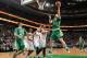 BOSTON, MA - MARCH 14: Kelly Olynyk #41 of the Boston Celtics shoots against the Phoenix Suns on March 14, 2014 at the TD Garden in Boston, Massachusetts. NOTE TO USER: User expressly acknowledges and agrees that, by downloading and or using this photogr