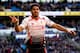 CARDIFF, WALES - MARCH 22: Luis Suarez of Liverpool celebrates after scoring hihs third and his team's sixth goal of the game during the Barclays Premier League match between Cardiff City and Liverpool at Cardiff City Stadium on March 22, 2014 in Cardiff