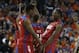 Mar 22, 2014; Buffalo, NY, USA; Dayton Flyers forward Dyshawn Pierre (21) and Dayton Flyers forward Kendall Pollard (22) celebrate beating the Syracuse Orange after a men's college basketball game during the third round of the 2014 NCAA Tournament at Firs