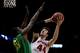 MILWAUKEE, WI - MARCH 22: Frank Kaminsky #44 of the Wisconsin Badgers shoots the ball against Richard Amardi #13 of the Oregon Ducks during the third round of the 2014 NCAA Men's Basketball Tournament at BMO Harris Bradley Center on March 22, 2014 in Mil