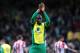 NORWICH, ENGLAND - MARCH 22: Sebastien Bassong of Norwich City applauds the Norwich fans after the Barclays Premier League match between Norwich City and Sunderland at Carrow Road on March 22, 2014 in Norwich, England. (Photo by Alex Broadway/Getty Image