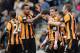HULL, ENGLAND - MARCH 22: Shane Long of Hull City is congratulated by his team-mates after scoring the second goal during the Barclays Premier League match between Hull City and West Bromwich Albion at the KC Stadium on March 22, 2014 in Hull, England.