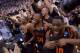 RALEIGH, NC - MARCH 21: Jibri Bryan #34 and Ike Nwamu #10 of the Mercer Bears celebrate with teammates after defeating the Duke Blue Devils 78-71 in the second round of the 2014 NCAA Men's Basketball Tournament at PNC Arena on March 21, 2014 in Raleigh,