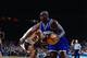 NEW YORK - APRIL 24: Anthony Mason #14 of the Charlotte Hornets drives to the basket against Buck Williams #52 of the New York Knicks in Game One of the Eastern Conference Quarterfinals during the 1997 NBA Playoffs at Madison Square Garden on April 24, 1