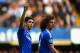 LONDON, ENGLAND - MARCH 22: Oscar of Chelsea celebrates scoring their fifth goal with David Luiz of Chelsea during the Barclays Premier League match between Chelsea and Arsenal at Stamford Bridge on March 22, 2014 in London, England. (Photo by Shaun Bot