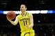 Mar 22, 2014; Milwaukee, WI, USA; Michigan Wolverines guard Nik Stauskas (11) lays the ball up in the first half of a men's college basketball game against the Texas Longhorns during the third round of the 2014 NCAA Tournament at BMO Harris Bradley Center
