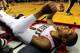 Mar 16, 2014; Portland, OR, USA; Portland Trail Blazers guard Damian Lillard (0) lays on the court after missing a shot during the fourth quarter of the game against the Golden State Warriors at the Moda Center. The Warriors won the game 113-112. Mandato