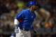 Mar 12, 2014; Peoria, AZ, USA; Chicago Cubs left fielder Junior Lake (21) runs first base after hitting a first inning single against the Seattle Mariners at Peoria Sports Complex. Mandatory Credit: Joe Camporeale-USA TODAY Sports