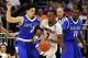 Mar 22, 2014; Orlando, FL, USA; Louisville Cardinals guard Russ Smith (2) drives against Saint Louis Billikens guard Austin McBroom (2) in the first half of a men's college basketball game during the third round of the 2014 NCAA Tournament at Amway Center