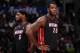 LOS ANGELES, CA - FEBRUARY 5: LeBron James #6 and Greg Oden #20 of the Miami Heat look on against the Los Angeles Clippers at Staples Center on February 5, 2014 in Los Angeles, California. NOTE TO USER: User expressly acknowledges and agrees that, by down