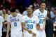 SAN DIEGO, CA - MARCH 23: Aubrey Williams #30 Nick Kazemi #0 and Noah Allen #22 of the UCLA Bruins celebrate their 77 to 60 win over the Stephen F. Austin Lumberjacks during the third round of the 2014 NCAA Men's Basketball Tournament at Viejas Arena on