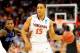 RALEIGH, NC - MARCH 23: Malcolm Brogdon #15 of the Virginia Cavaliers handles the ball against Joe Jackson #1 of the Memphis Tigers in the first half during the third round of the 2014 NCAA Men's Basketball Tournament at PNC Arena on March 23, 2014 in Ral