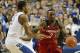 Dec 28, 2013; Lexington, KY, USA; Louisville Cardinals guard Russ Smith (2) dribbles against Kentucky Wildcats guard Aaron Harrison (2) during the second half at Rupp Arena. Kentucky defeated Louisville 73-66. Mandatory Credit: Jamie Rhodes-USA TODAY Spo